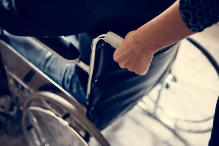 Close up of hands on wheelchair