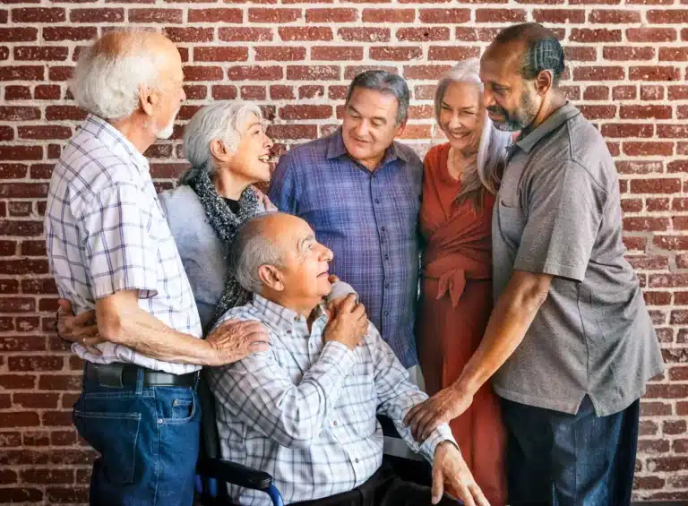 Group of elderly with man in wheelchair
