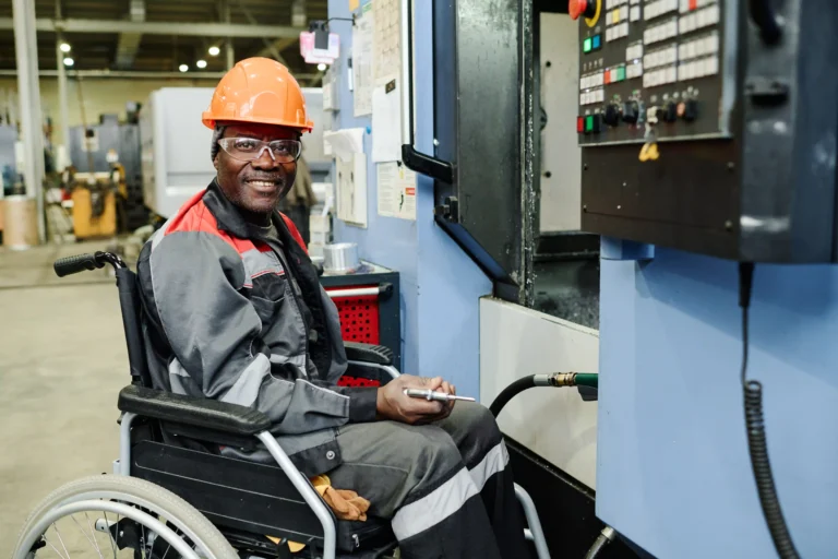 Wheelchair man operating machinery