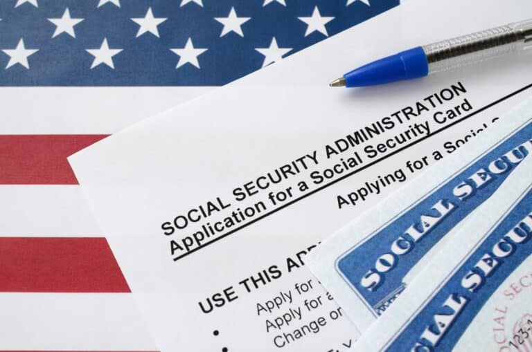 Social Security application form and cards with U.S. flag